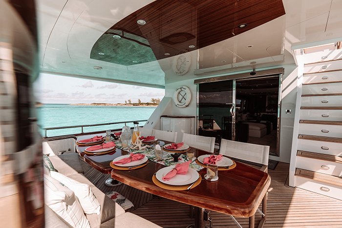 Beachfront yacht aft deck dining