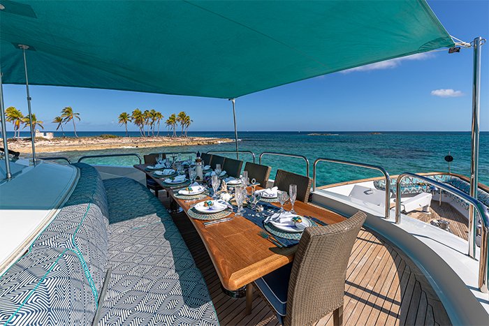 Motor yacht Sweet Escape deck dining with bimini b